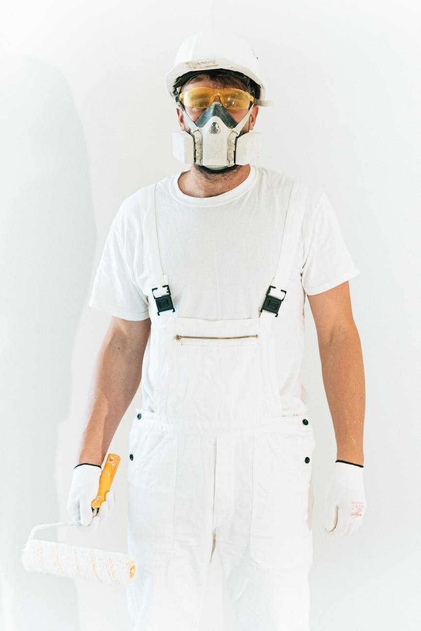 a man wearing safety glasses and respirator mask